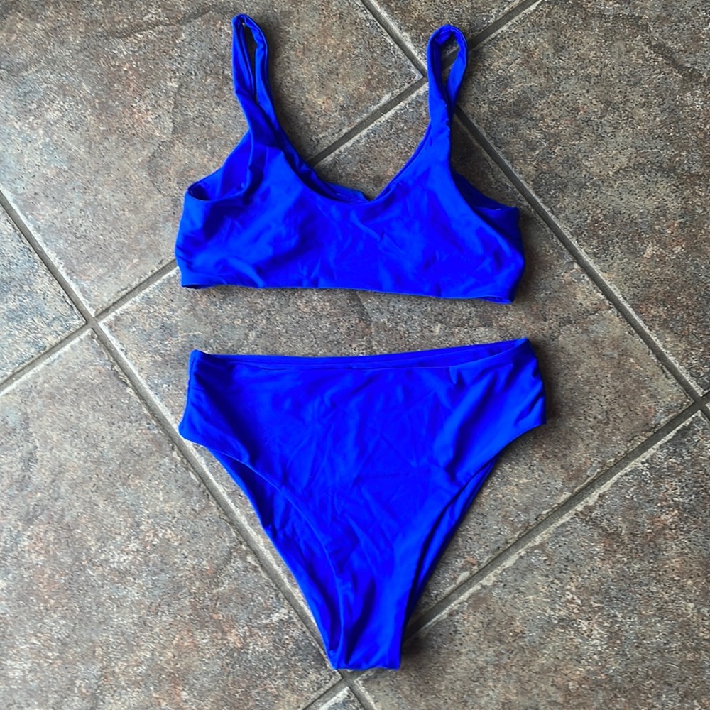 Bikini size medium. Brand new, never worn still has sanitary liner in bottoms
